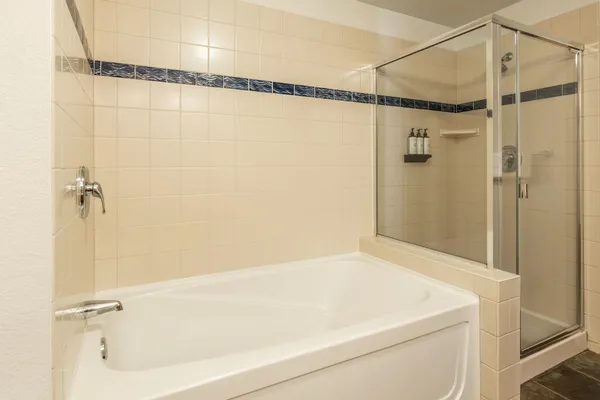 a bathroom with a shower and a shower