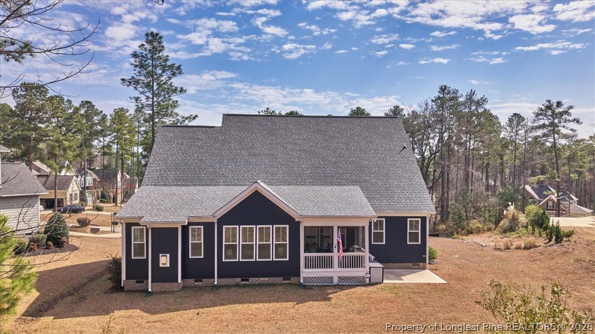 10 Heatherspring Way Spring Lake, NC 28390 - Photo 45 of 48 a front view of a house with a garden and tree