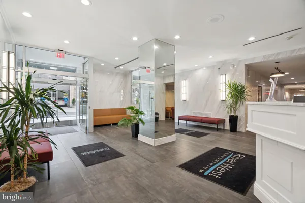 a living room with furniture and a rug