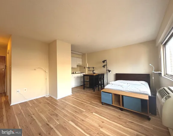 a bedroom with a bed and a table