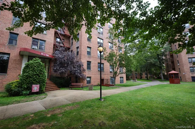 a house view with a sitting space and garden
