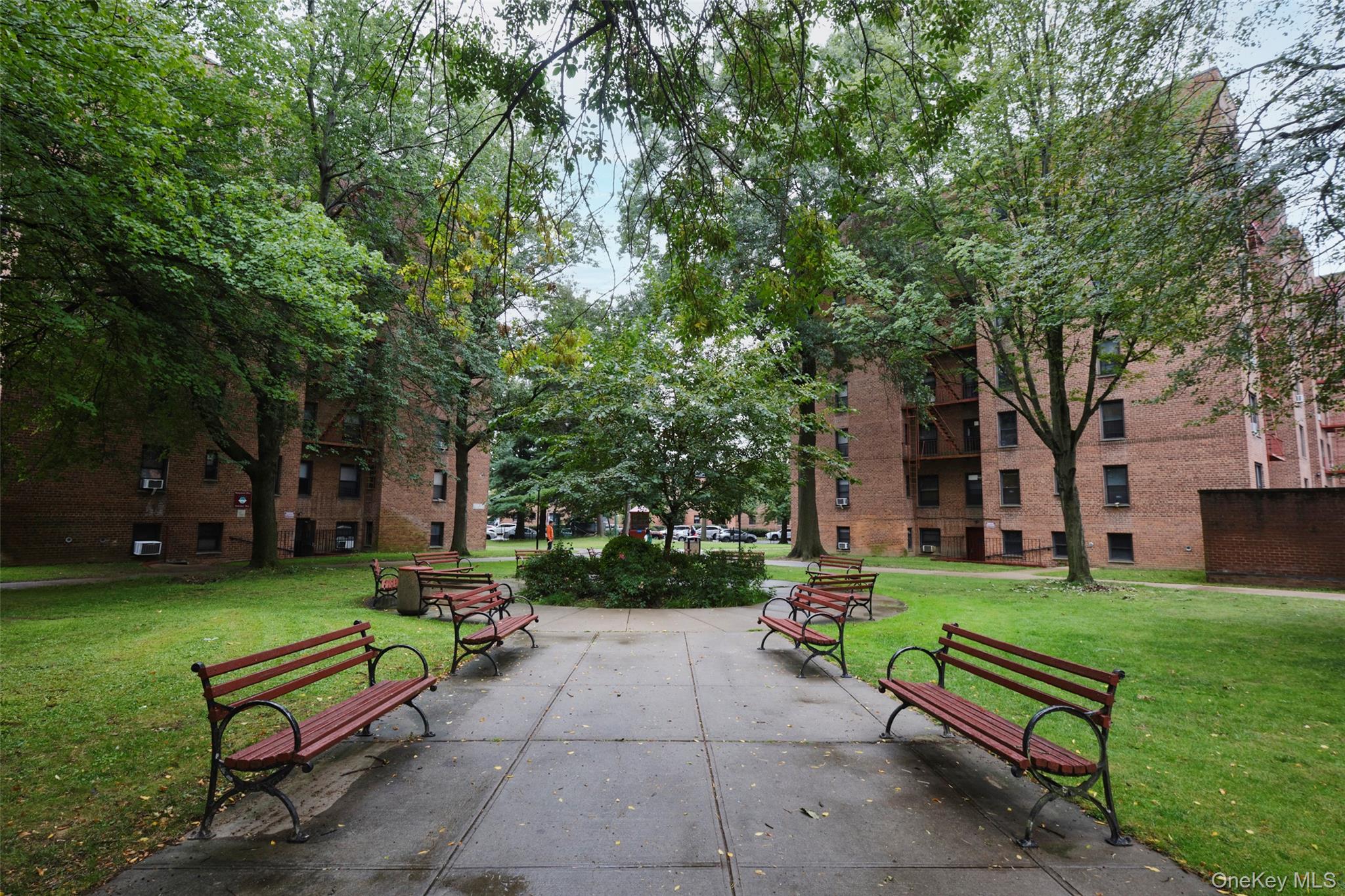 150-11 72nd Road, Unit 1C Queens, NY 11367 - Photo 23 of 25 View of home's community with a lawn