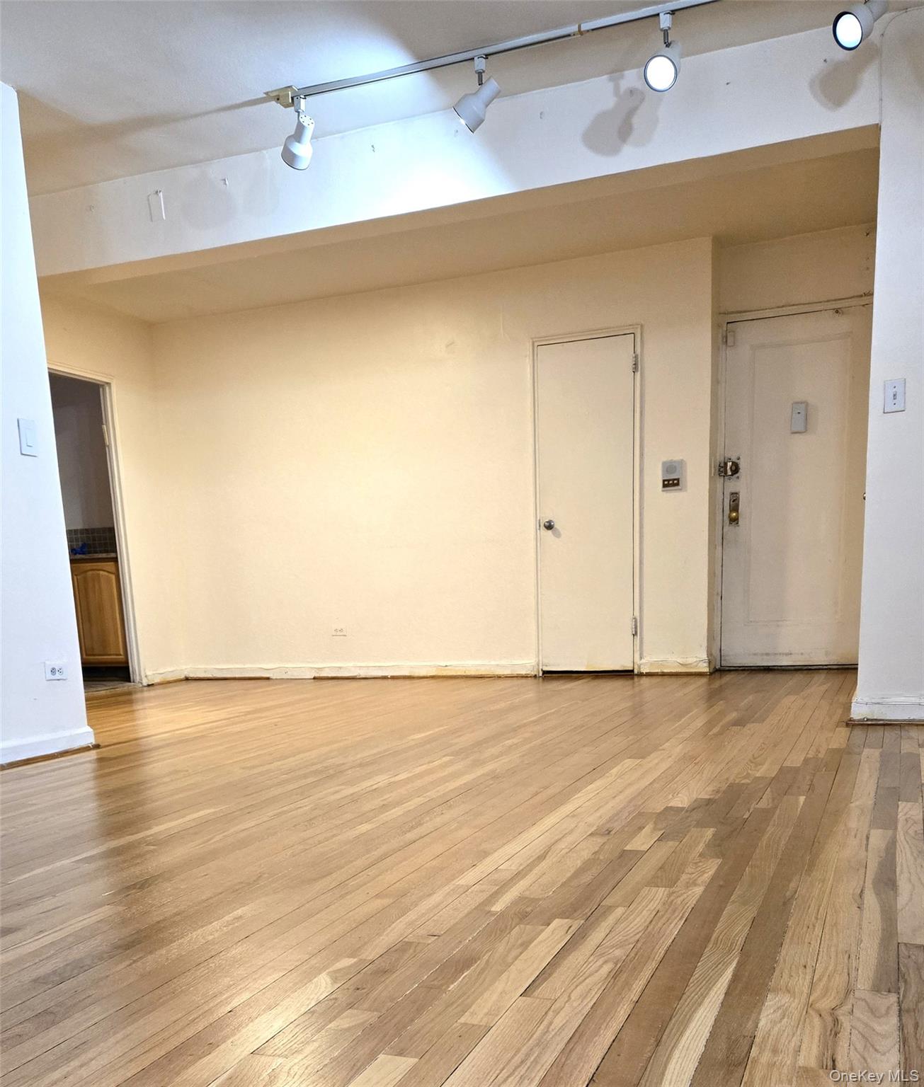 150-11 72nd Road, Unit 1C Queens, NY 11367 - Photo 4 of 25 Living room looking to the front door