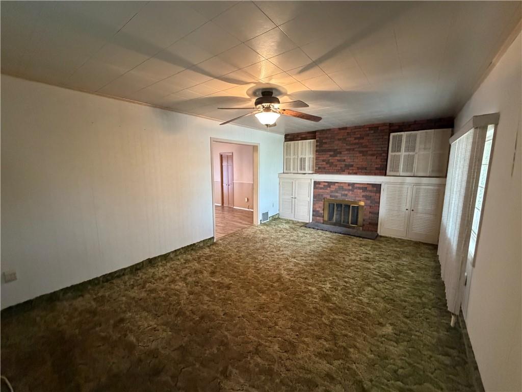 1041 4th Street Monongahela, PA 15063 - Photo 17 of 28 en empty room with windows and refrigerator