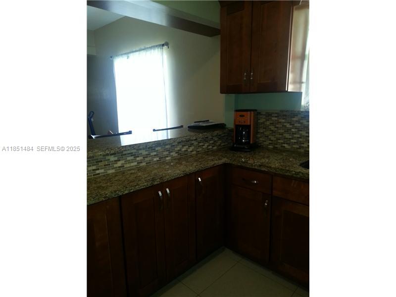 321 Northwest 13th Avenue Miami, FL 33125 - Photo 9 of 13 a kitchen with a sink and a window