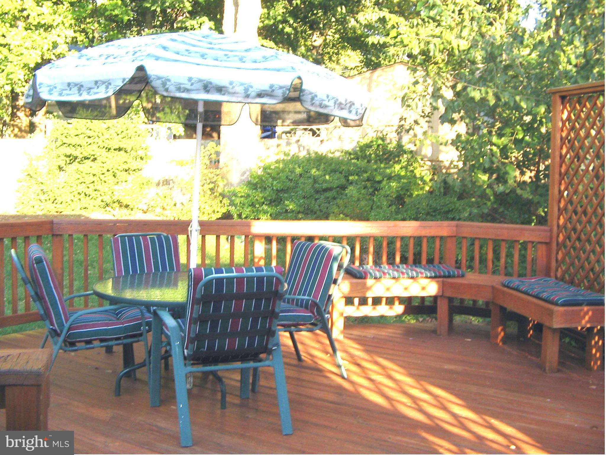 10511 Procter Street Silver Spring, MD 20901 - Photo 11 of 13 a view of a chair and table on the deck