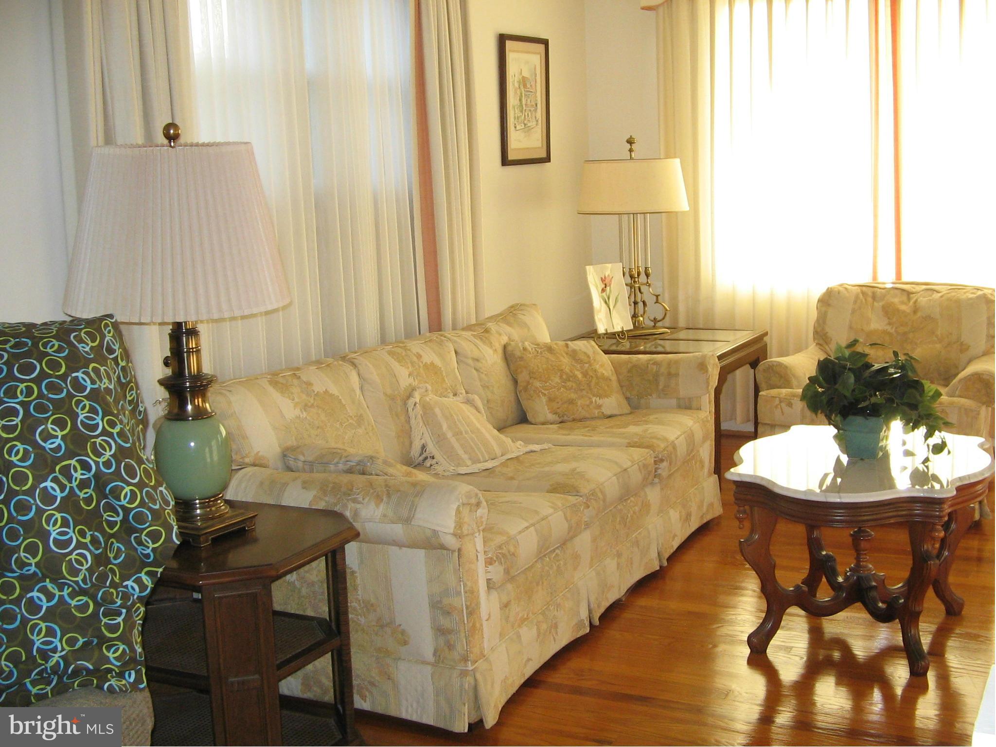10511 Procter Street Silver Spring, MD 20901 - Photo 4 of 13 a living room with furniture and a dining table