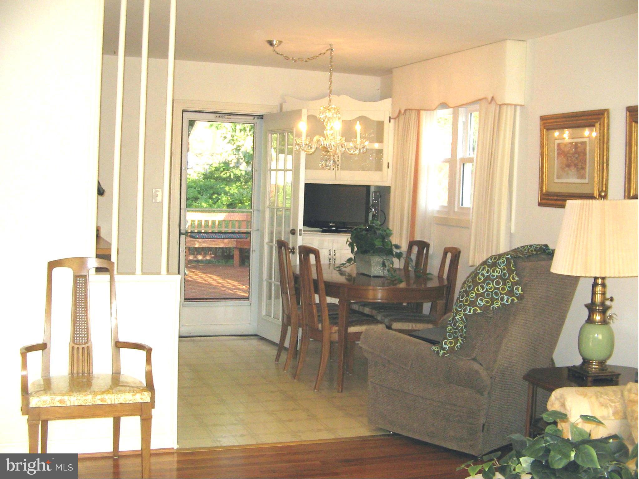 10511 Procter Street Silver Spring, MD 20901 - Photo 7 of 13 a living room with furniture a flat screen tv and a large window
