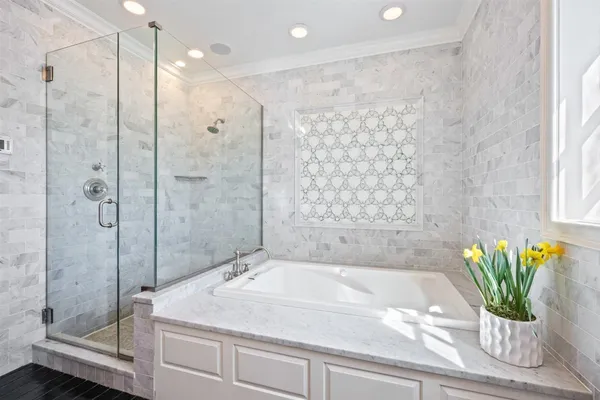 a bathroom with a granite countertop sink a toilet and bathtub