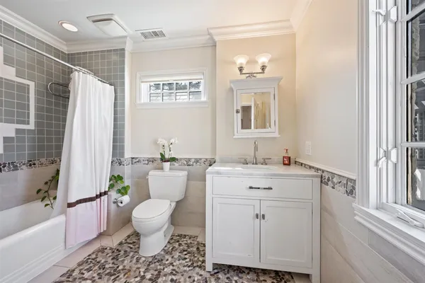 a bathroom with a sink and toilet