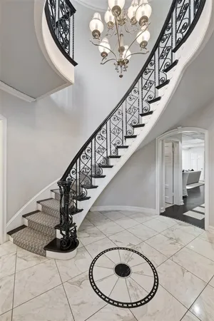 a view of entryway and hall with a front door