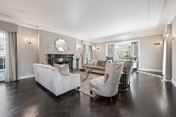 a living room with furniture wooden floor and a fireplace