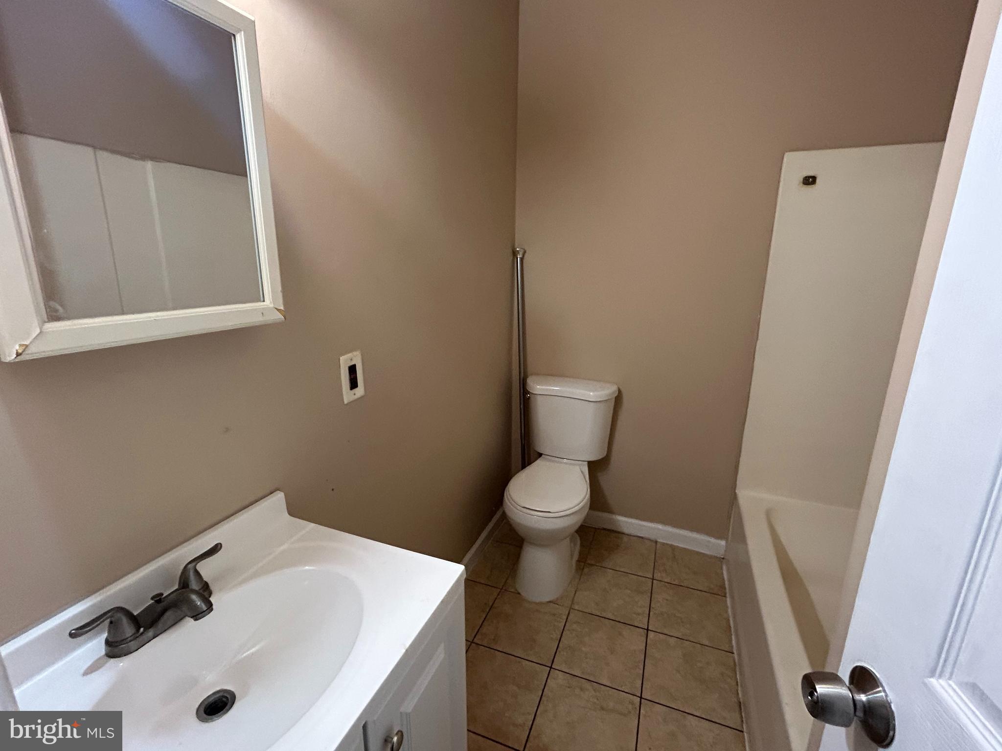 34 Washington Street, Unit 1A Mount Holly, NJ 08060 - Photo 7 of 8 a bathroom with a sink and a toilet