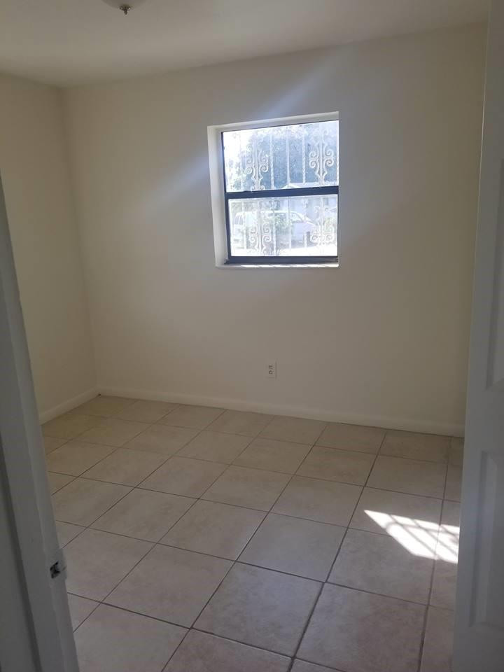6830 Southwest 23rd Street Miramar, FL 33023 - Photo 12 of 17 an empty room with a window