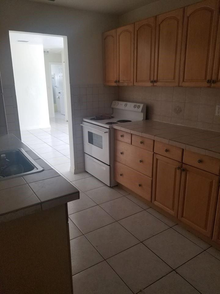 6830 Southwest 23rd Street Miramar, FL 33023 - Photo 17 of 17 a kitchen with cabinets and appliances