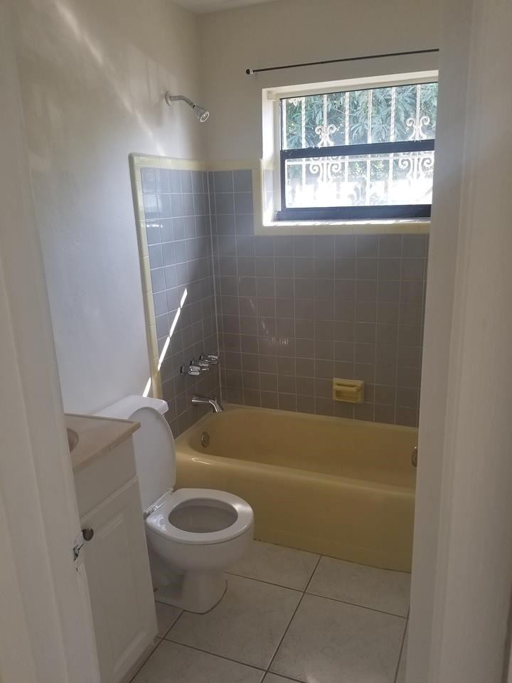 6830 Southwest 23rd Street Miramar, FL 33023 - Photo 5 of 17 a bathroom with a granite countertop bathtub a toilet and a shower