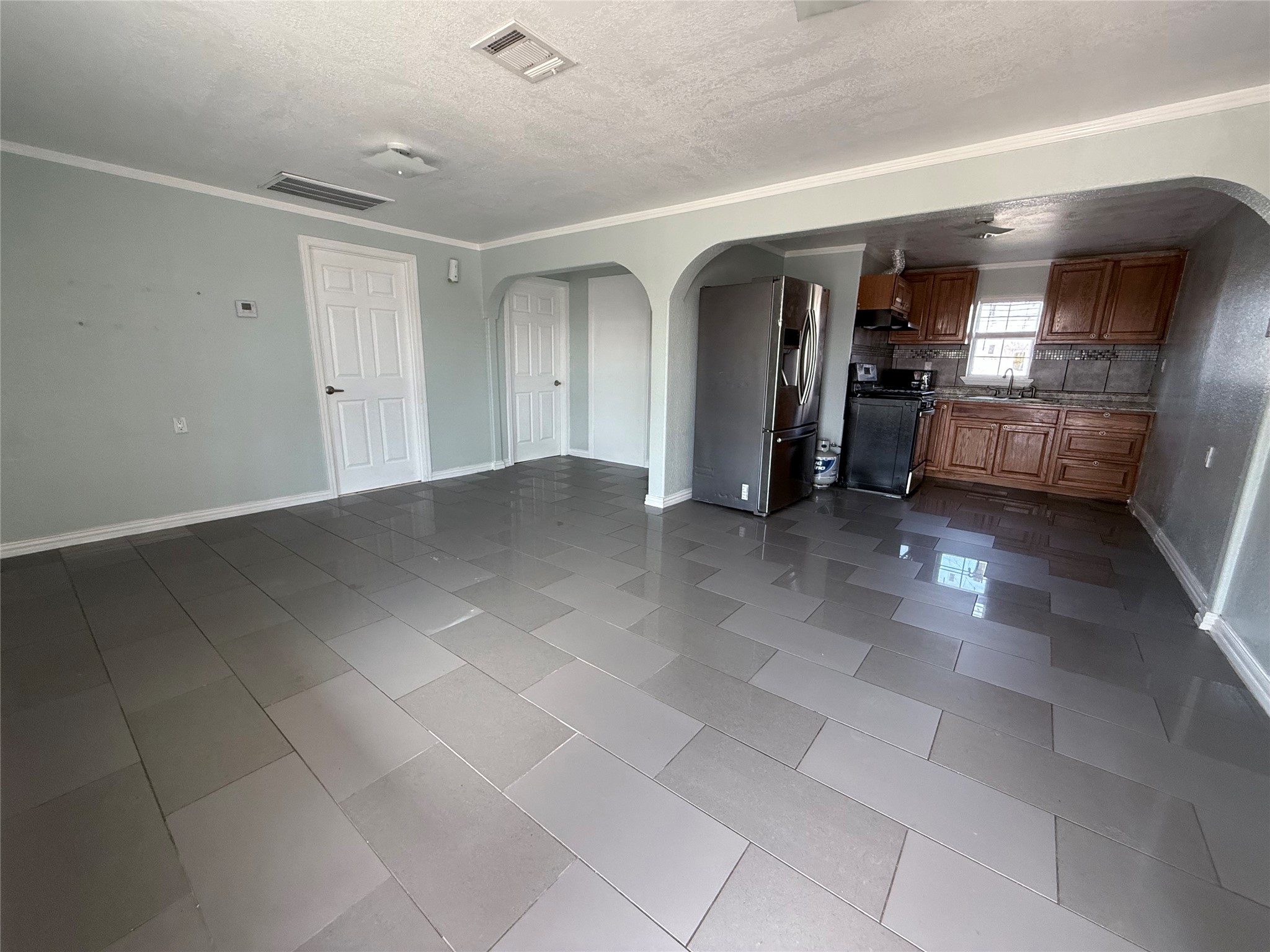 13809 Hershe Street, Unit B Houston, TX 77015 - Photo 3 of 9 a view of a hallway with some storage and utility