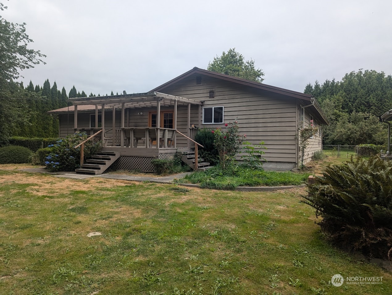 18429 Tualco Road Monroe, WA 98272 - Photo 3 of 5 a front view of a house with garden