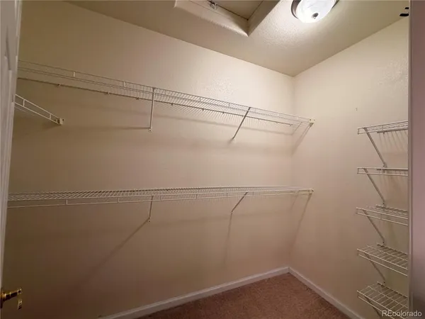 a view of a room with racks on the wall