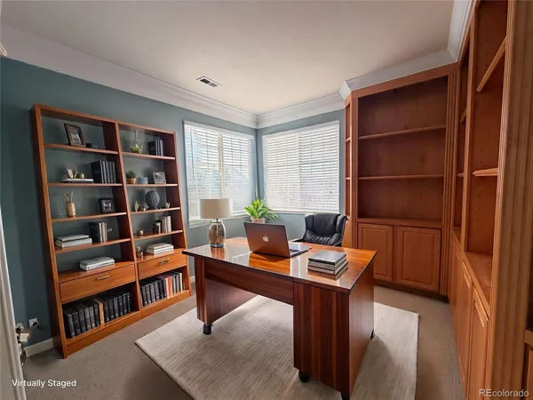 a room with furniture and a book shelf