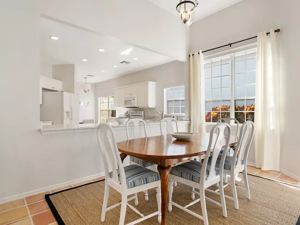 a dining room with furniture and window