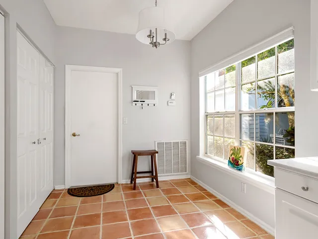 a bathroom with a mirror and a shower