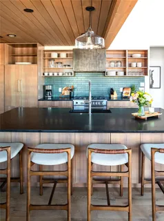 a kitchen with a table and chairs in it