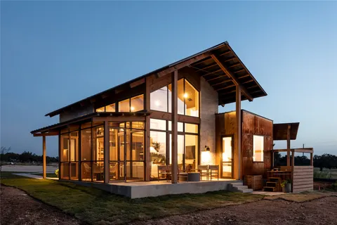 an aerial view of a house with a garden