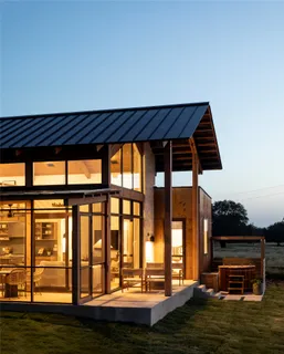 a view of front door and porch with wooden floor