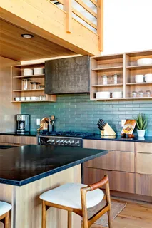 a kitchen with a table and chairs in it