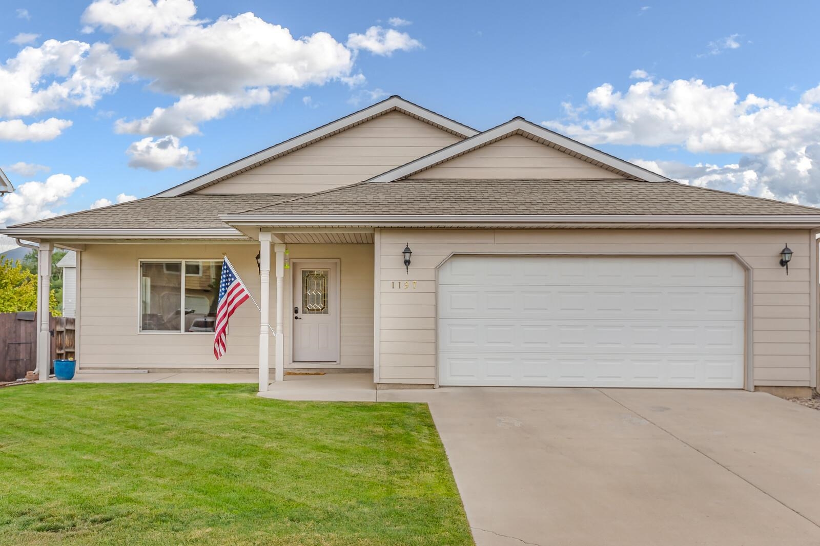 1197 East 18th Way Rifle, CO 81650 - Photo 1 of 19 front view of house with a yard
