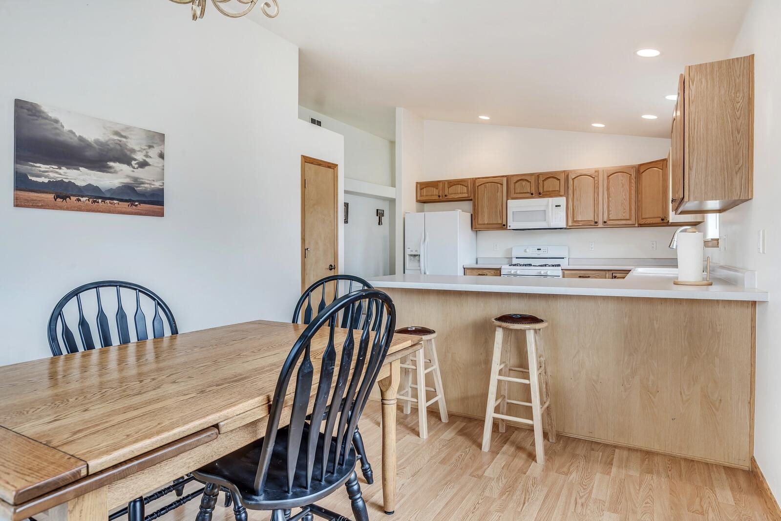 1197 East 18th Way Rifle, CO 81650 - Photo 11 of 19 a dining room with furniture and wooden floor