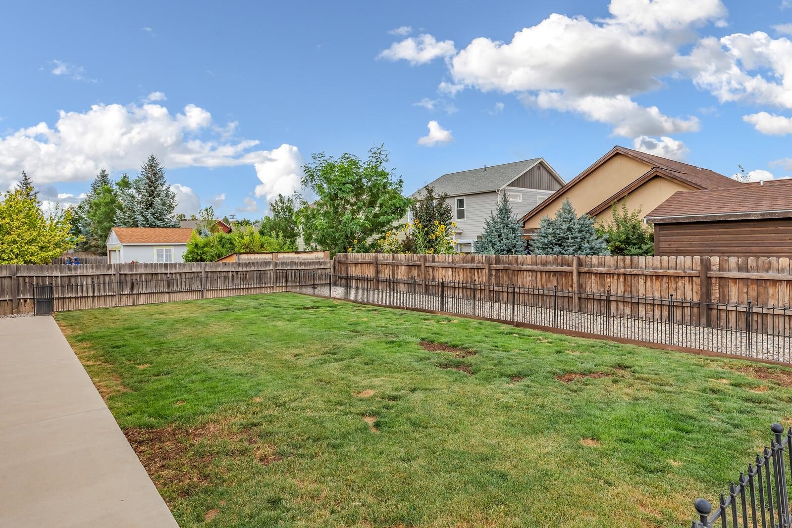 1197 East 18th Way Rifle, CO 81650 - Photo 19 of 19 a view of a backyard with a garden and plants