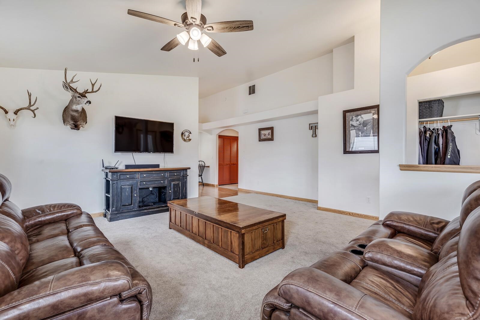 1197 East 18th Way Rifle, CO 81650 - Photo 4 of 19 a living room with furniture and a flat screen tv