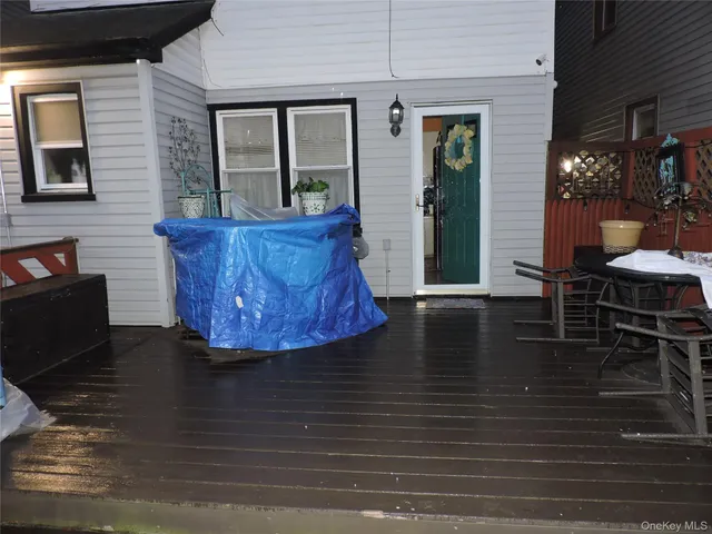 a view of a patio with table and chairs and potted plants