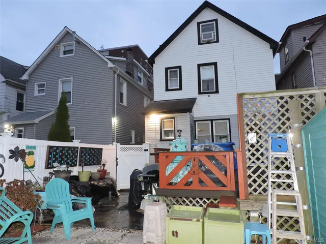 a front view of a building with glass windows and a table