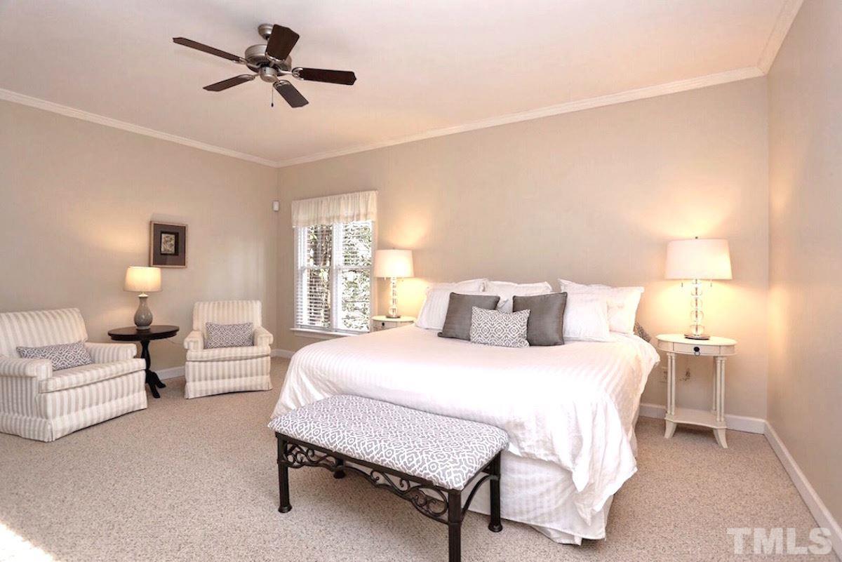 320 Northchester Way Raleigh, NC 27614 - Photo 14 of 22 a bedroom with a bed a lamp and a couch