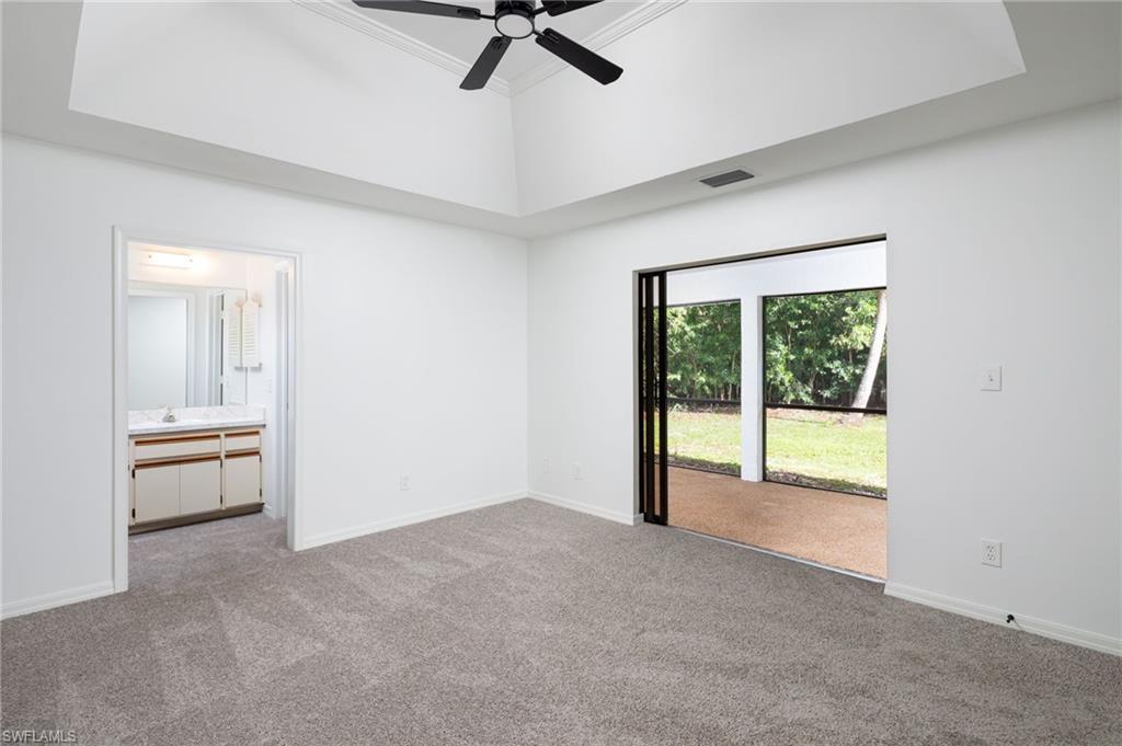 5671 Green Boulevard Naples, FL 34116 - Photo 19 of 37 a view of an empty room with a window