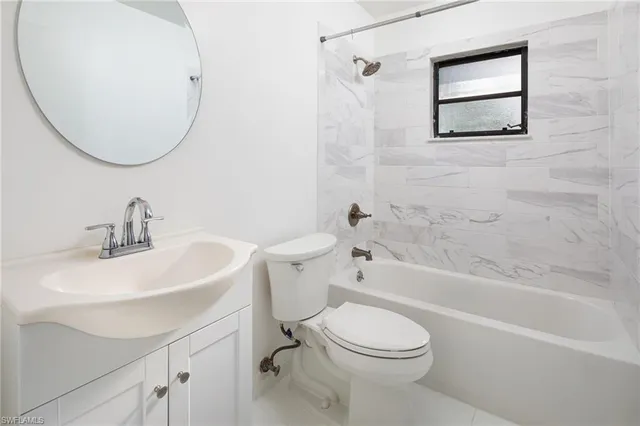 a bathroom with a sink a toilet and a bathtub