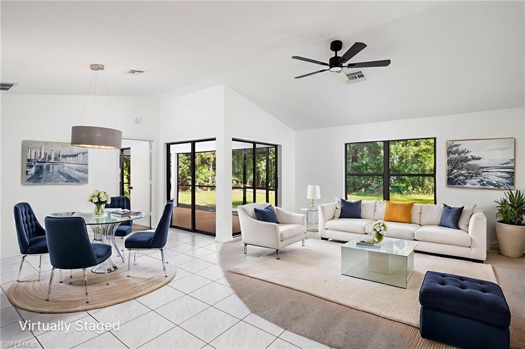 5671 Green Boulevard Naples, FL 34116 - Photo 4 of 37 a living room with furniture