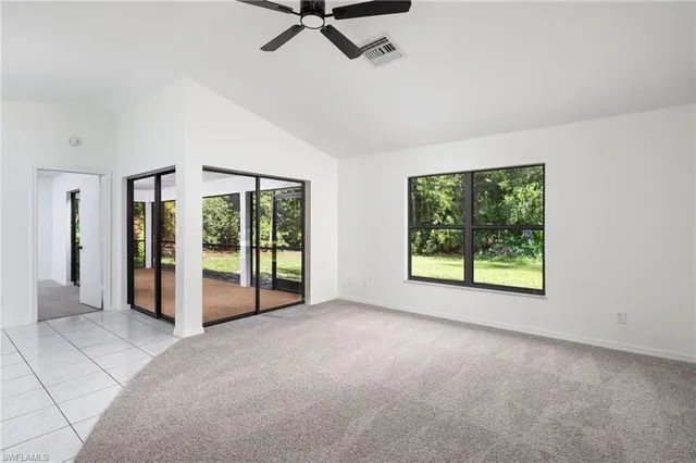 a view of a big room with windows and closet