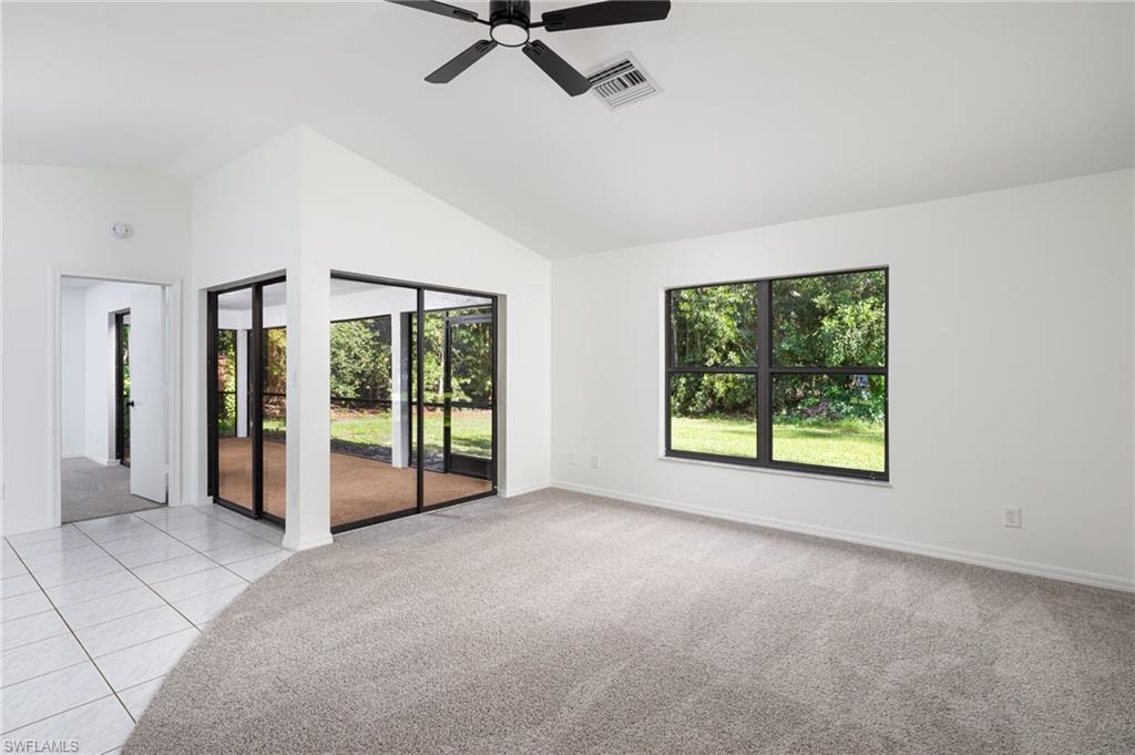 5671 Green Boulevard Naples, FL 34116 - Photo 5 of 37 a view of a big room with windows and closet