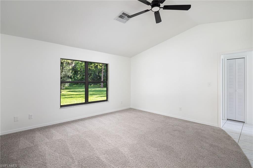 5671 Green Boulevard Naples, FL 34116 - Photo 7 of 37 a view of a livingroom with a ceiling fan and window