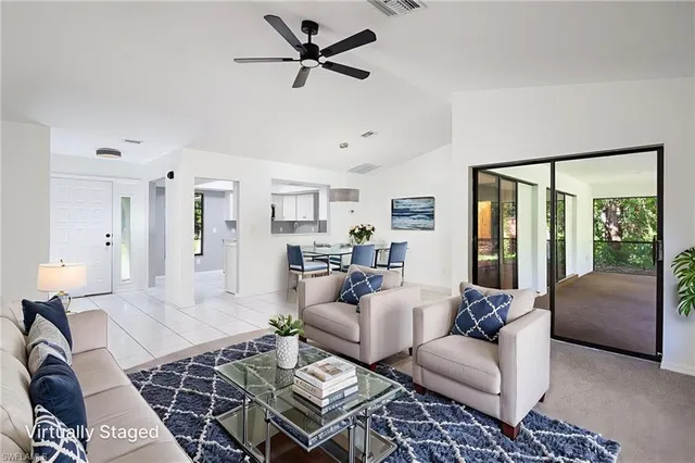 a living room with furniture and a rug