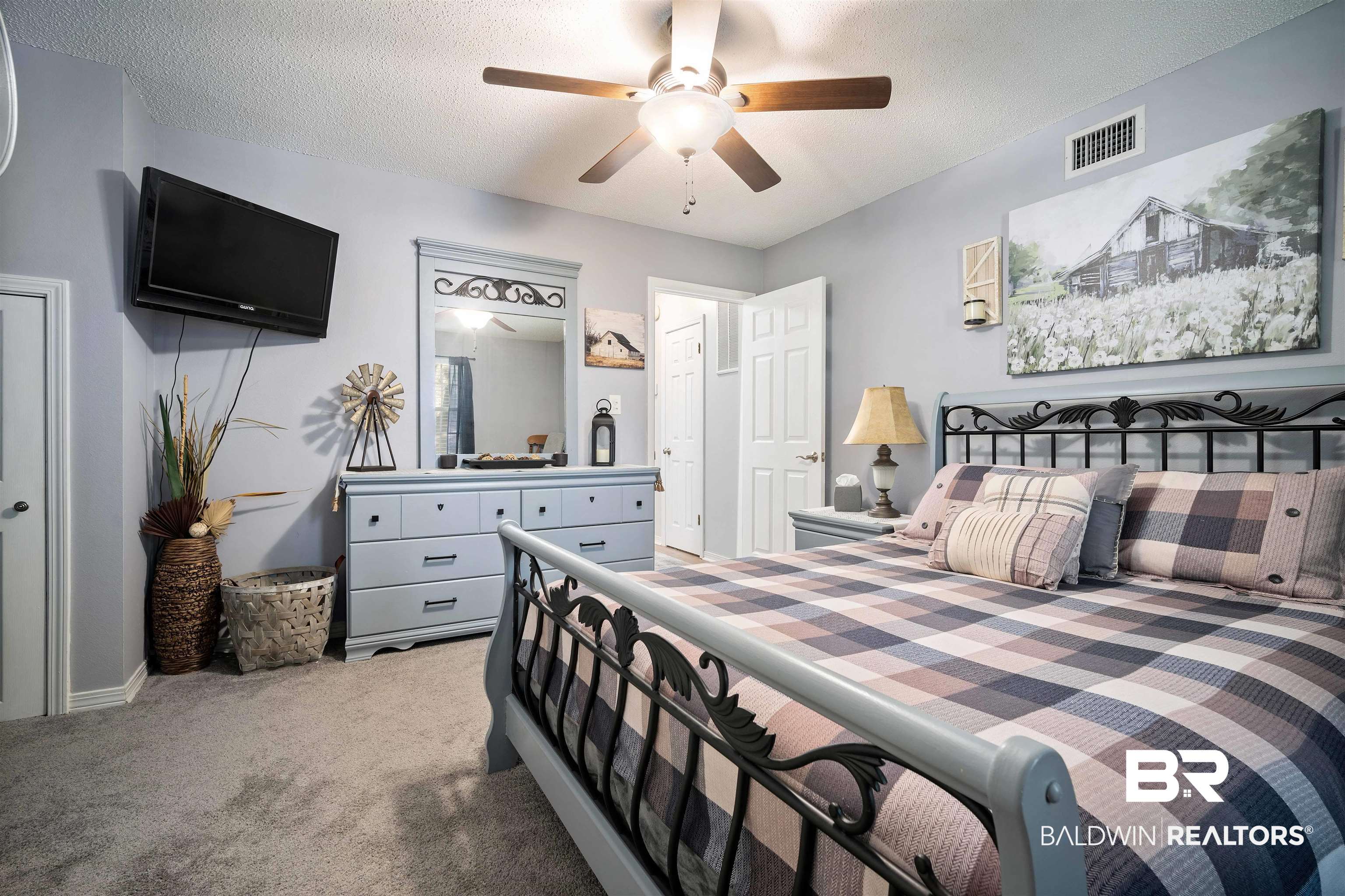110 Lakeview Loop Daphne, AL 36526 - Photo 22 of 40 Carpeted bedroom featuring visible vents, a textured ceiling, and ceiling fan