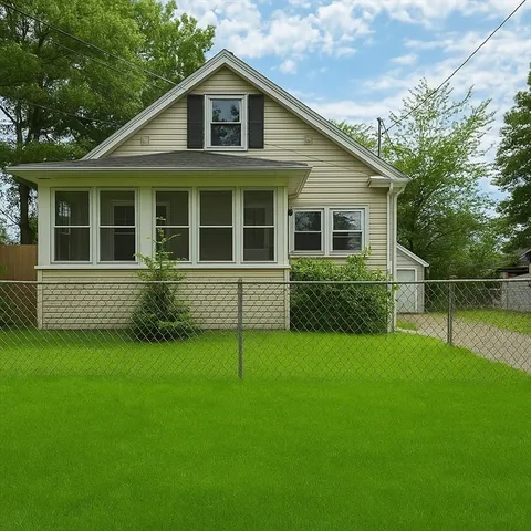 a view of a house with a yard