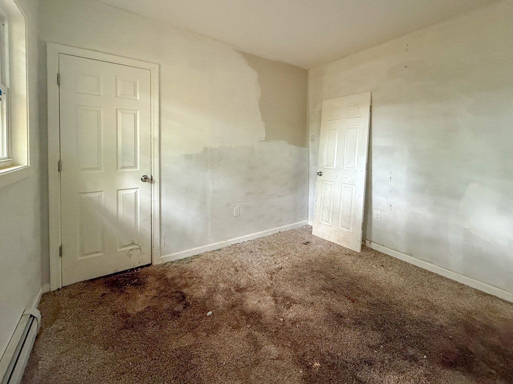 23 Eldert Street Springfield, MA 01109 - Photo 14 of 27 an empty room with closet area