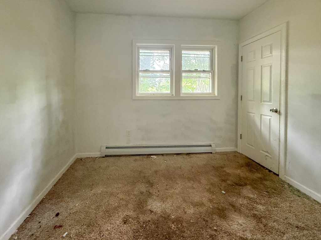 23 Eldert Street Springfield, MA 01109 - Photo 16 of 27 an empty room with a window