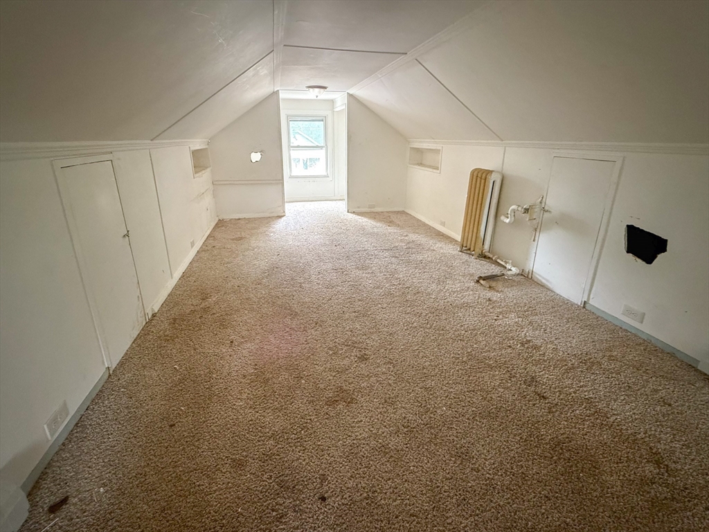 23 Eldert Street Springfield, MA 01109 - Photo 17 of 27 a view of a big room with closet and windows