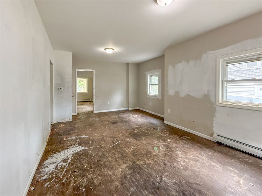 23 Eldert Street Springfield, MA 01109 - Photo 22 of 27 an empty room with windows and closet